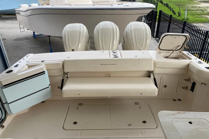 Slide: The Image of 2025 Grady-White Freedom 345 boat with triple engines and spacious deck layout. - 18