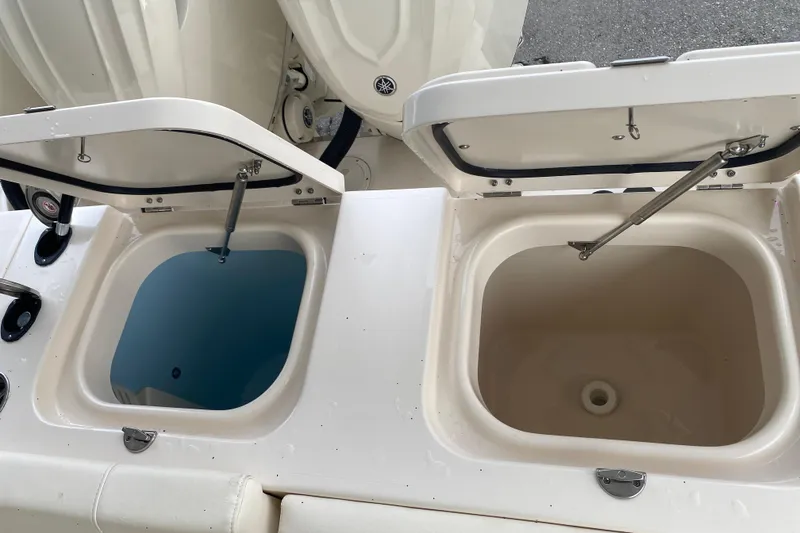 Slide: The Image of 2025 Grady-White Freedom 345 boat with open storage compartments. - 21