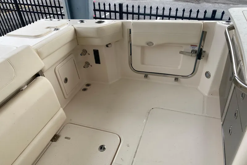 Slide: The Image of 2025 Grady-White Freedom 345 boat interior with seating and storage compartments. - 22