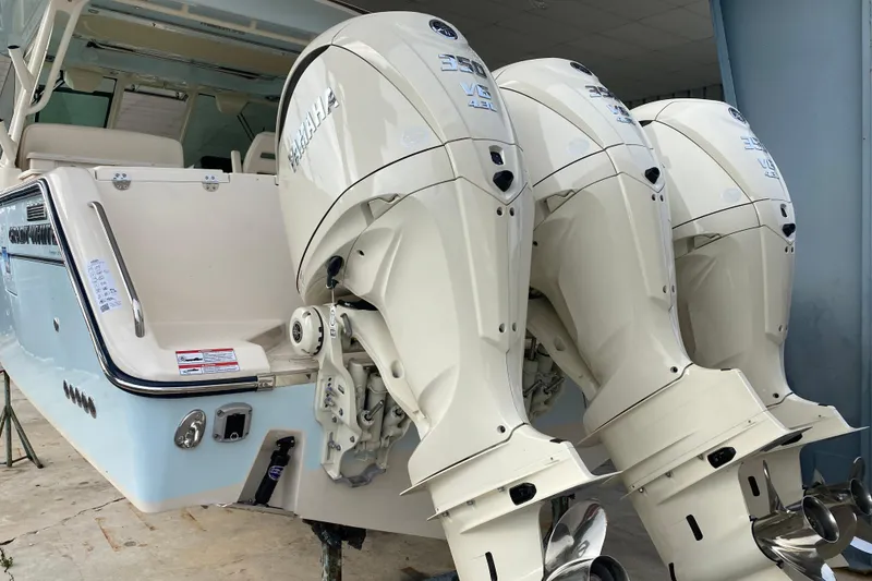 Slide: The Image of 2025 Grady-White Freedom 345 boat with triple Yamaha 350 outboard engines. - 24