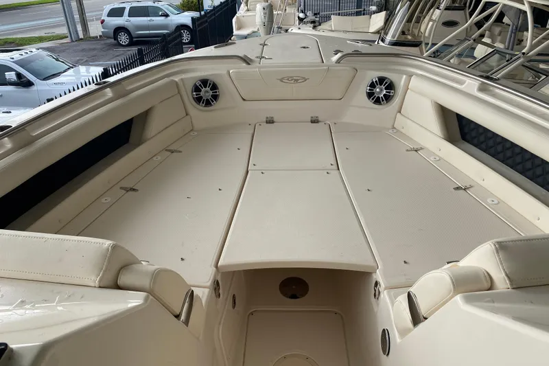 Slide: The Image of 2025 Grady-White Freedom 345 boat interior with spacious seating and speakers. - 5
