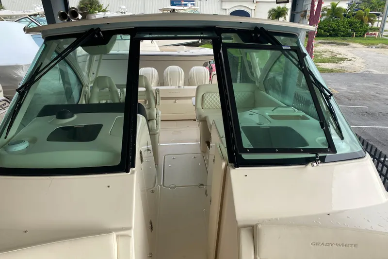 Slide: The Image of 2025 Grady-White Freedom 345 boat interior with seating and windshield view. - 6