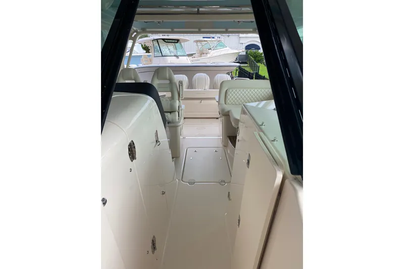 Slide: The Image of 2025 Grady-White Freedom 345 interior with luxurious seating and sleek design. - 7