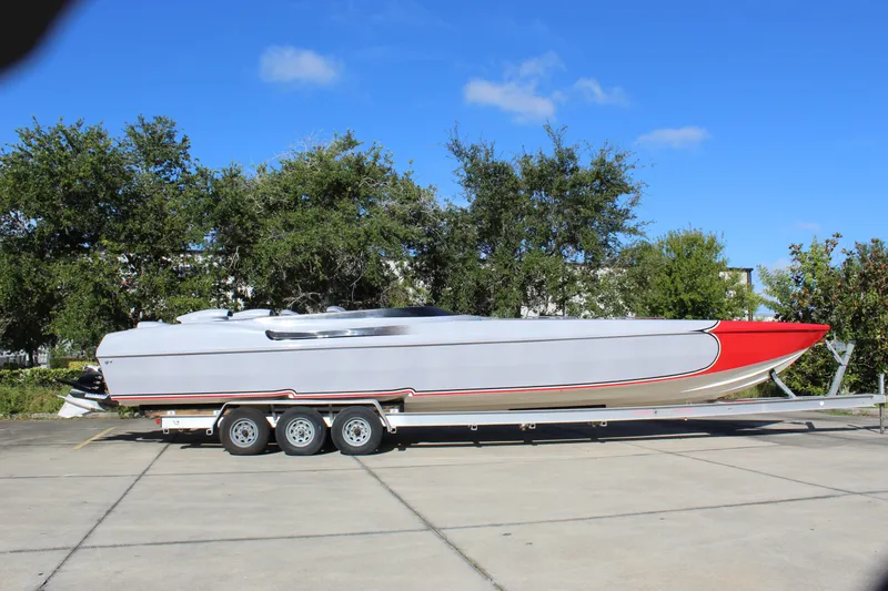 Slide: The Image of 2007 Chaudron 41 SS powerboat on trailer, sleek design, red and white color scheme. - 11