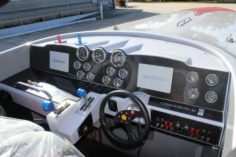 Slide: The Image of Dashboard of 2007 Chaudron 41 SS boat with Garmin displays and multiple gauges. - 28