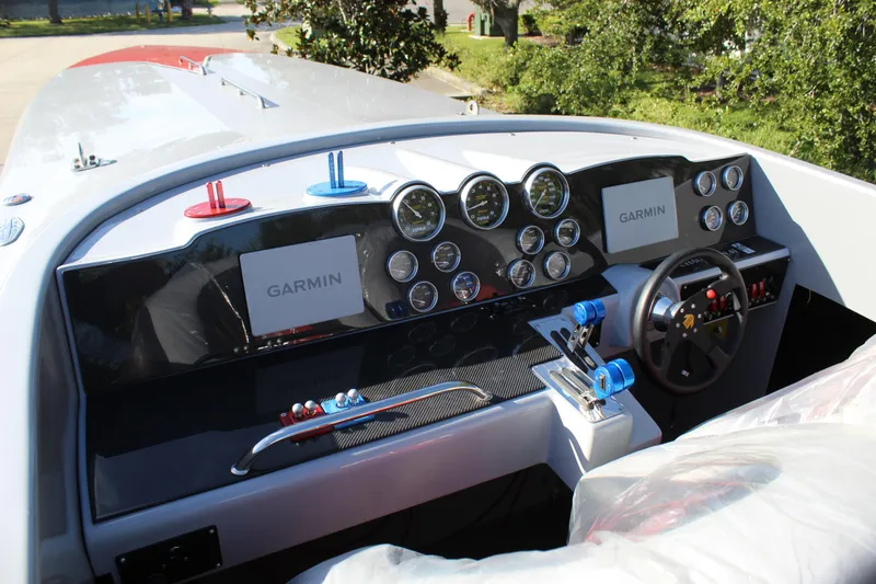 Slide: The Image of Dashboard of 2007 Chaudron 41 SS boat with Garmin navigation system and multiple gauges. - 29