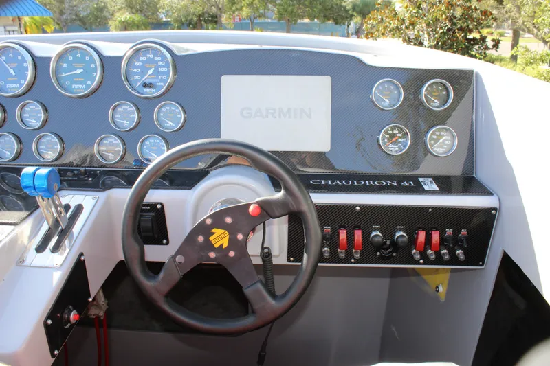 Slide: The Image of Dashboard of 2007 Chaudron 41 SS boat with gauges and steering wheel. - 30