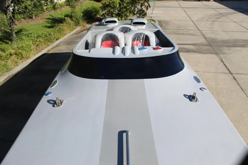 Slide: The Image of 2007 Chaudron 41 SS speedboat with sleek design, parked on concrete driveway. - 32