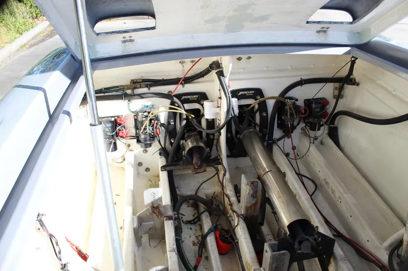 Slide: The Image of Engine compartment of 2007 Chaudron 41 SS boat, featuring Mercury engines and mechanical components. - 40