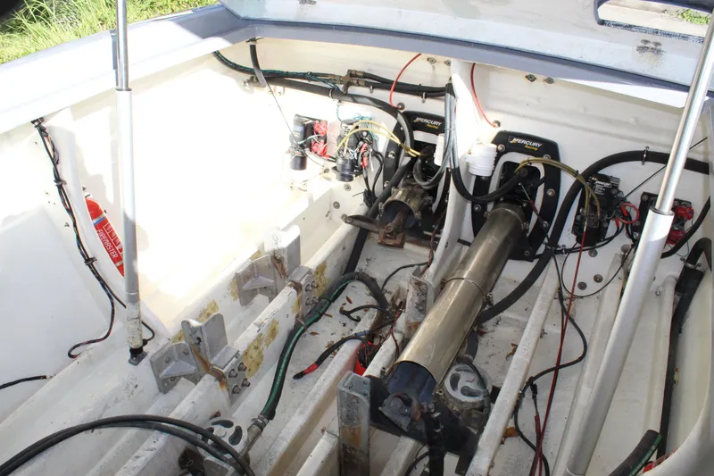 Slide: The Image of Engine compartment of a 2007 Chaudron 41 SS boat, showing mechanical components and wiring. - 41