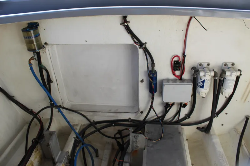 Slide: The Image of Engine compartment of 2007 Chaudron 41 SS boat with wiring and filters visible. - 42