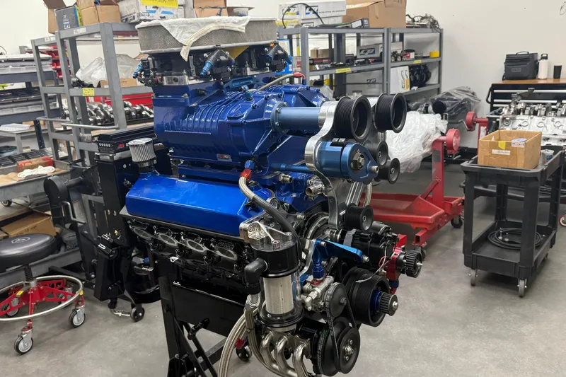 Slide: The Image of High-performance engine in workshop, Chaudron 41 SS, 2007 model, with blue components and pulleys. - 46