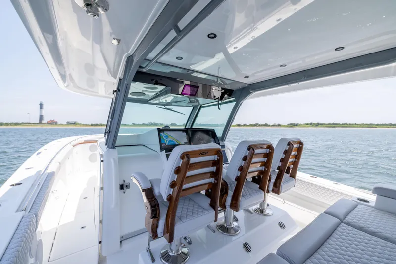 Slide: The Image of 2026 HCB 48 Campeon boat interior with luxurious seating and advanced navigation system. - 11