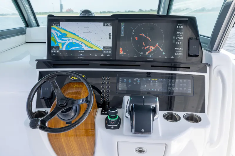 Slide: The Image of Helm of 2026 HCB 48 Campeon with advanced navigation displays and controls. - 15
