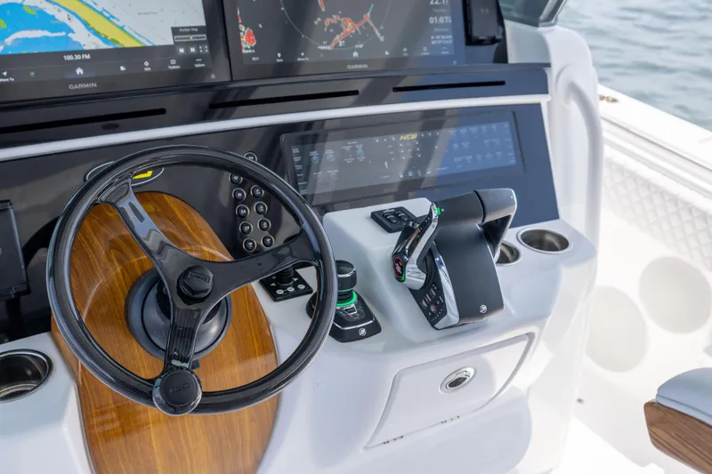 Slide: The Image of Helm of 2026 HCB 48 Campeon with advanced navigation displays and controls. - 16