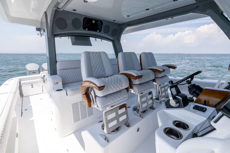 Slide: The Image of Luxurious interior of 2026 HCB 48 Campeon boat with plush seating and ocean view. - 17