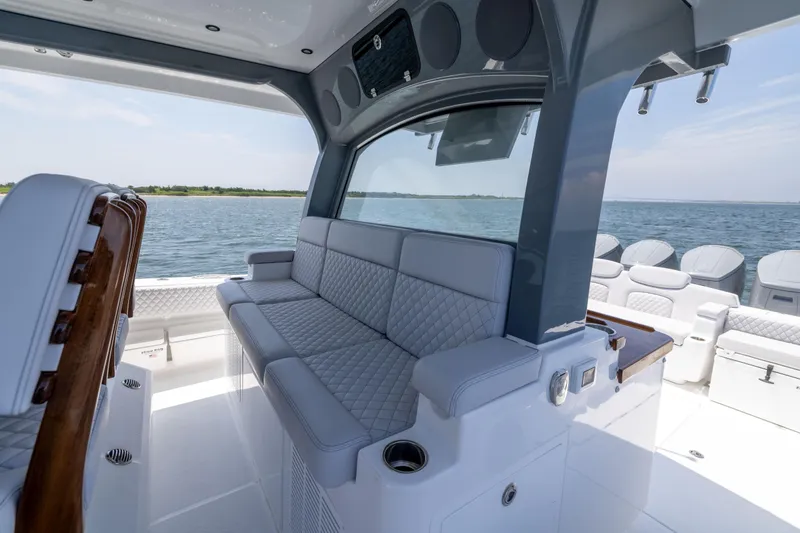Slide: The Image of Luxurious interior of 2026 HCB 48 Campeon boat with plush seating and ocean view. - 19