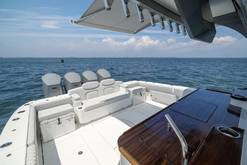 Slide: The Image of Luxurious 2026 HCB 48 Campeon boat interior with seating and ocean view. - 22