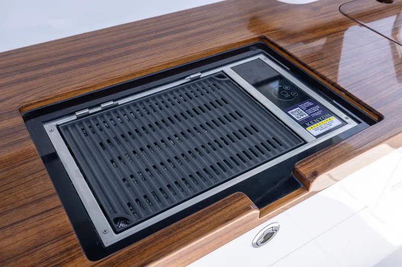 Slide: The Image of Built-in grill on HCB 48 Campeon yacht, 2026 model, with sleek wooden finish. - 25