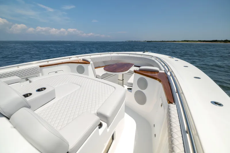 Slide: The Image of Luxurious 2026 HCB 48 Campeon yacht interior with plush seating and ocean view. - 30