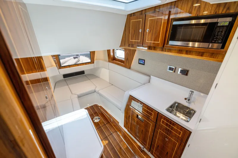 Slide: The Image of Luxurious interior of 2026 HCB 48 Campeon yacht with modern kitchen and seating area. - 36