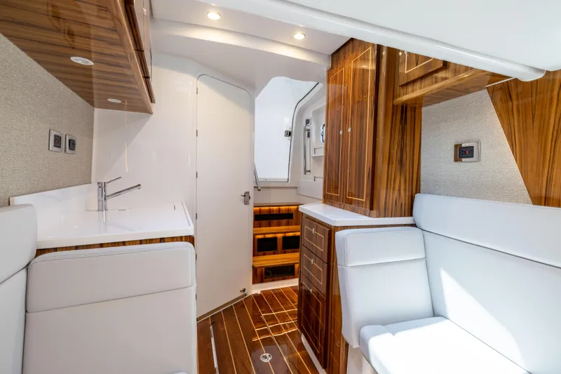 Slide: The Image of Luxurious interior of 2026 HCB 48 Campeon yacht with elegant wood finishes and modern amenities. - 37