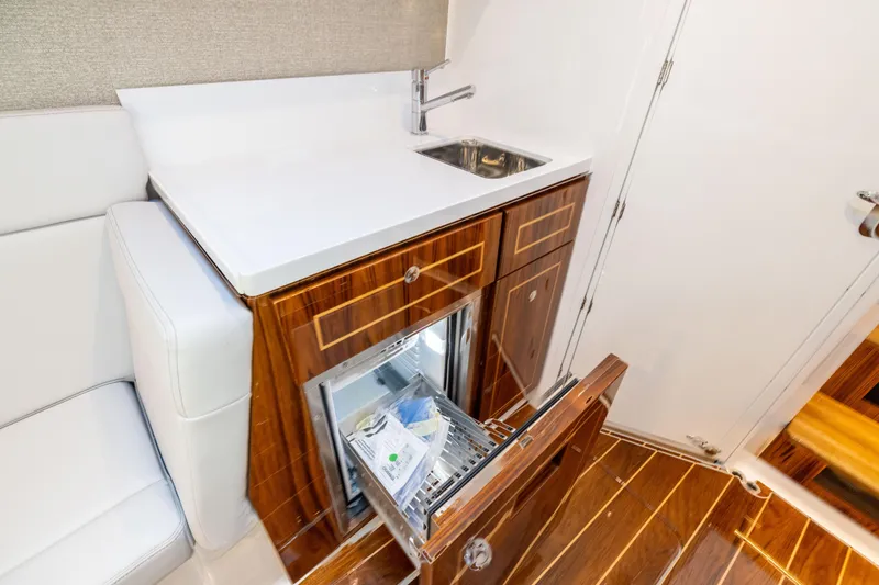 Slide: The Image of Luxurious interior of 2026 HCB 48 Campeon yacht with sink and mini fridge. - 39