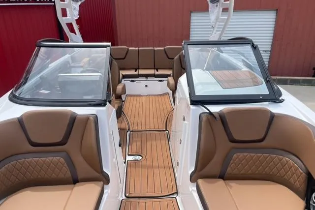 Slide: The Image of 2025 Yamaha Boats 252S interior with brown seating and sleek design. - 13
