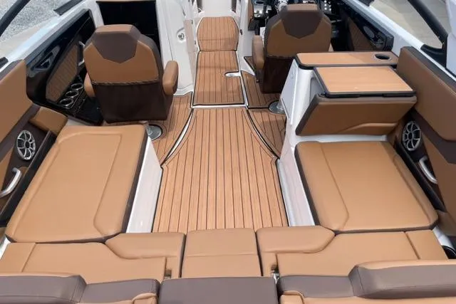 Slide: The Image of 2025 Yamaha Boats 252S interior with tan seating and sleek design. - 6