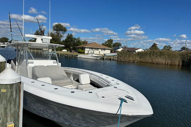 The Image of 2018 Invincible 42 boat docked on a sunny day with clear blue skies. - 0