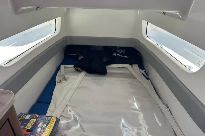 Slide: The Image of Interior cabin of 2018 Invincible 42 boat with windows and storage space. - 12