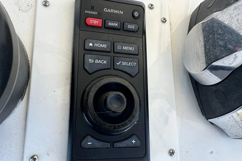 Slide: The Image of Control panel of a 2018 Invincible 42 boat featuring Garmin navigation system. - 17