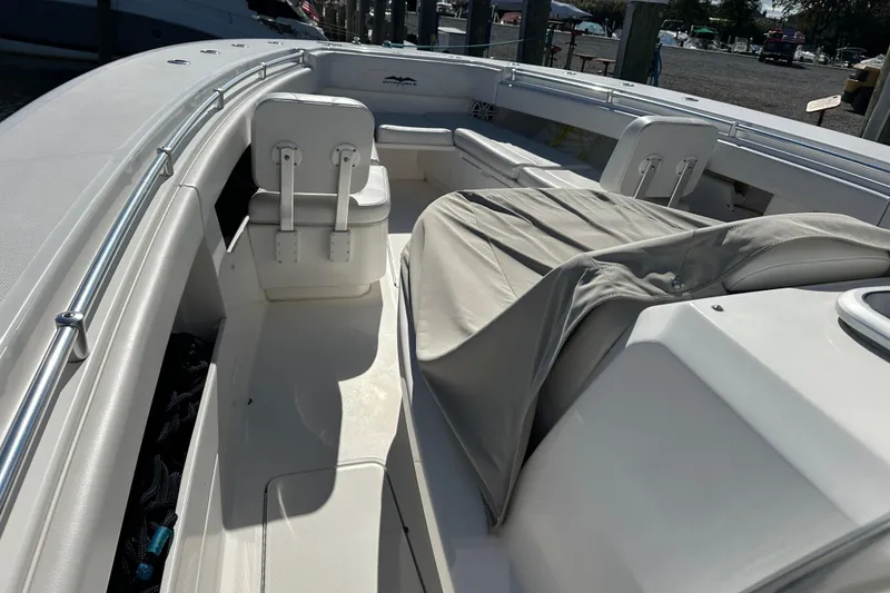 Slide: The Image of 2018 Invincible 42 boat interior with seating and covered console. - 3