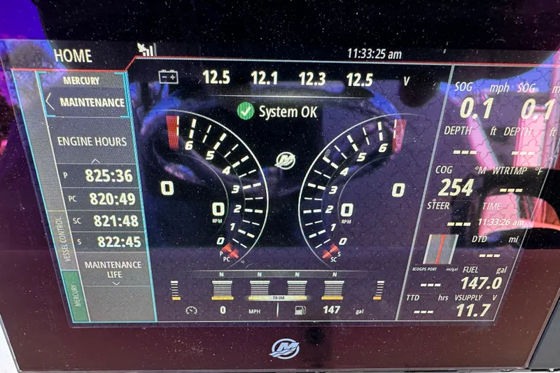 Slide: The Image of Digital dashboard of a 2018 Invincible 42 boat showing engine and system status. - 9