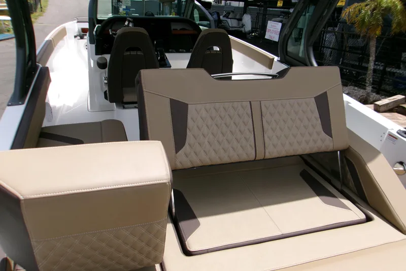 Slide: The Image of 2026 Monterey Elite 27 OB boat interior with luxurious seating and modern design. - 10