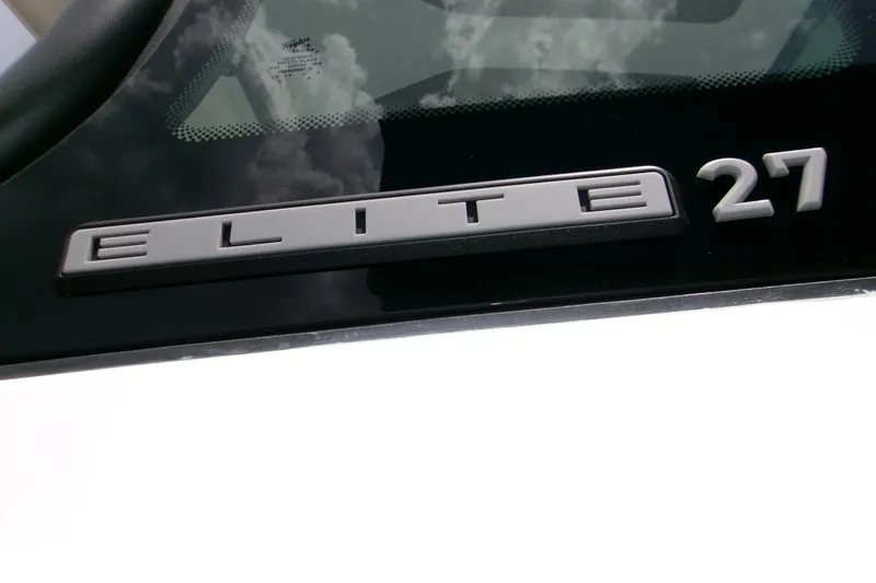 Slide: The Image of Monterey Elite 27 OB 2026 model emblem on sleek black surface. - 8