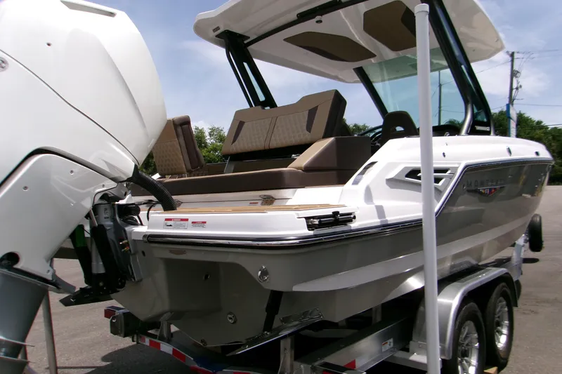 Slide: The Image of 2026 Monterey Elite 27 OB boat on trailer, featuring sleek design and powerful outboard motor. - 9