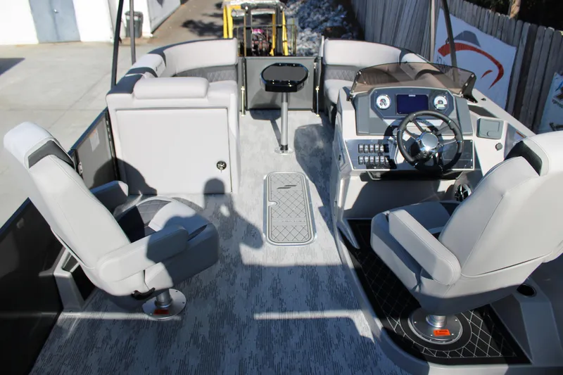Slide: The Image of 2026 Starcraft SLS 3 Q DH boat interior with modern helm and seating. - 11