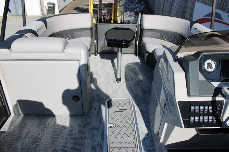 Slide: The Image of Interior of 2026 Starcraft SLS 3 Q DH boat with modern seating and control panel. - 18