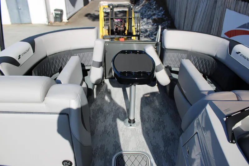 Slide: The Image of 2026 Starcraft SLS 3 Q DH boat interior with modern seating and table. - 19