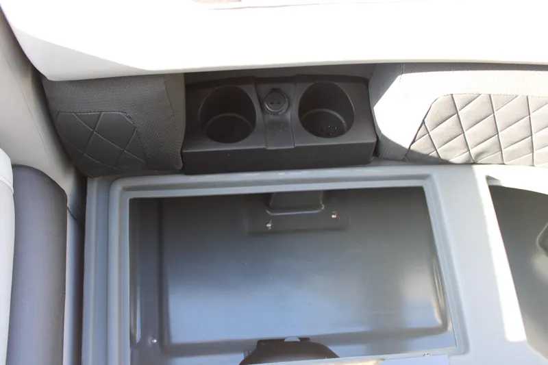 Slide: The Image of 2026 Starcraft SLS 3 Q DH interior with cup holders and storage compartment. - 21