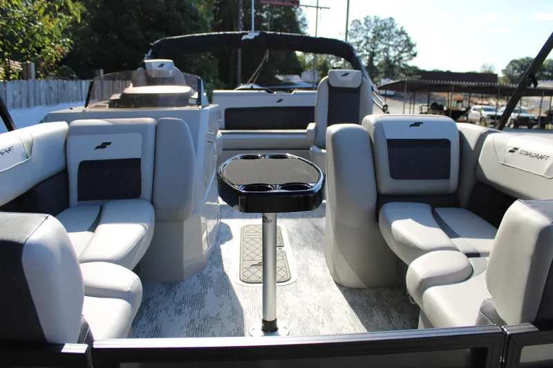 Slide: The Image of Interior of 2026 Starcraft SLS 3 Q DH boat with luxurious seating and table. - 22