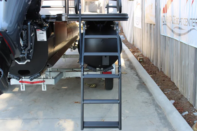 Slide: The Image of Rear view of 2026 Starcraft SLS 3 Q DH boat with ladder and trailer. - 5