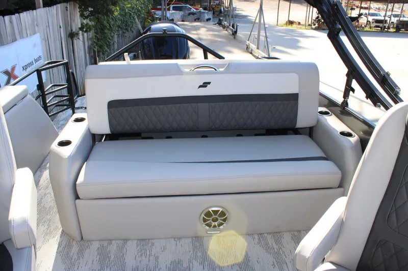 Slide: The Image of 2026 Starcraft SLS 3 Q DH boat interior with cushioned seating and cup holders. - 9