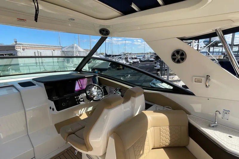 Slide: The Image of Interior of 2020 Sea Ray Sundancer 320 yacht with helm and seating area. - 22