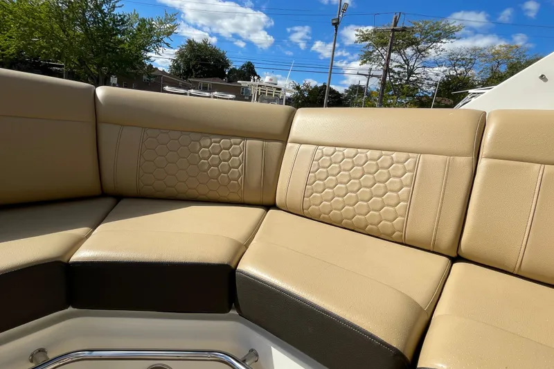 Slide: The Image of Luxurious seating on 2020 Sea Ray Sundancer 320 boat, featuring honeycomb-patterned upholstery. - 25