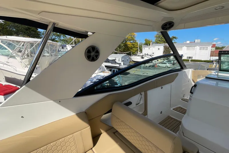 Slide: The Image of 2020 Sea Ray Sundancer 320 interior with beige seating and modern design. - 33