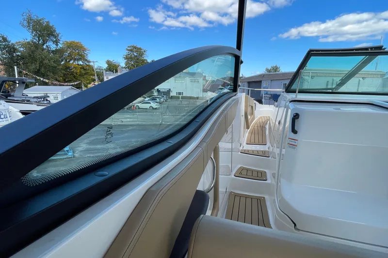 Slide: The Image of 2020 Sea Ray Sundancer 320 boat interior with sleek design and clear blue sky. - 41