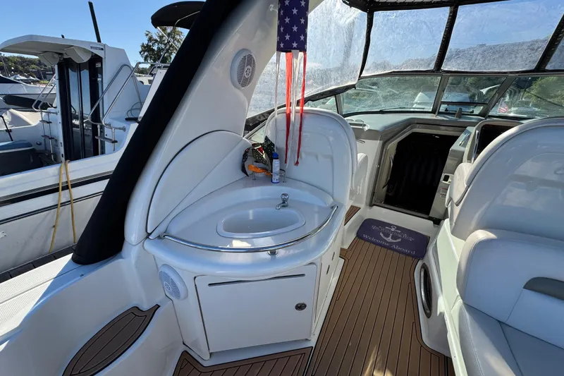 Slide: The Image of 2007 Sea Ray 340 Sundancer interior with sink, seating, and welcome mat. - 11