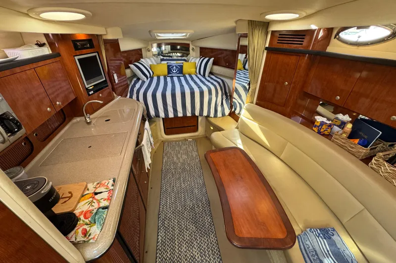Slide: The Image of Luxurious interior of 2007 Sea Ray 340 Sundancer yacht with cozy seating and elegant wood finishes. - 22